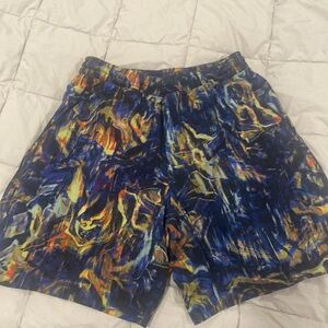 Mens Lulu shorts. Multi colored. Sz small. 6 in inseam. 2 sm holes on lining.